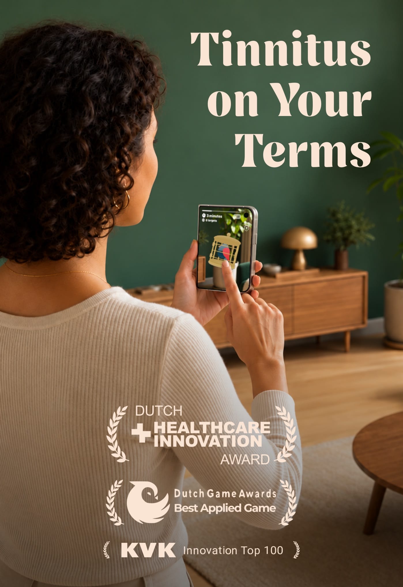 Someone practising Catch the Tone on an iPhone, with the title Tinnitus on Your Terms and the awards Freequency has won.