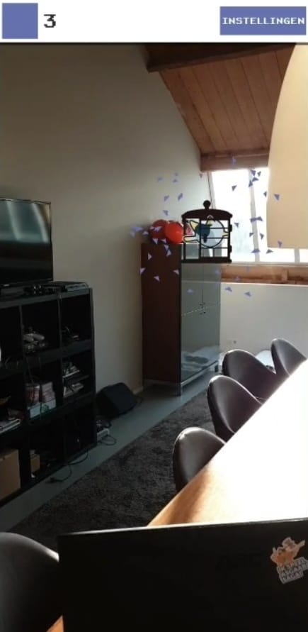 Screenshot of the first augmented-reality prototype, showing a birdcage floating in the office